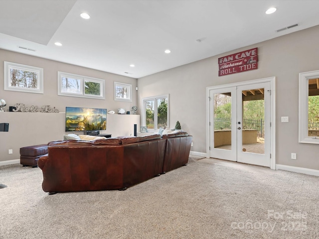 carpeted living room featuring french doors