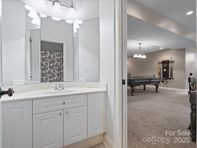 bathroom featuring billiards and vanity