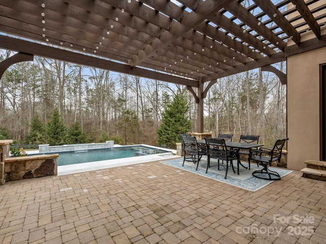 exterior space with a pergola, a patio area, and a hot tub