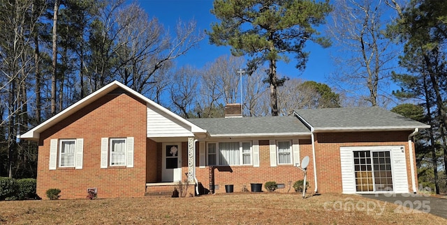 ranch-style home with a front lawn