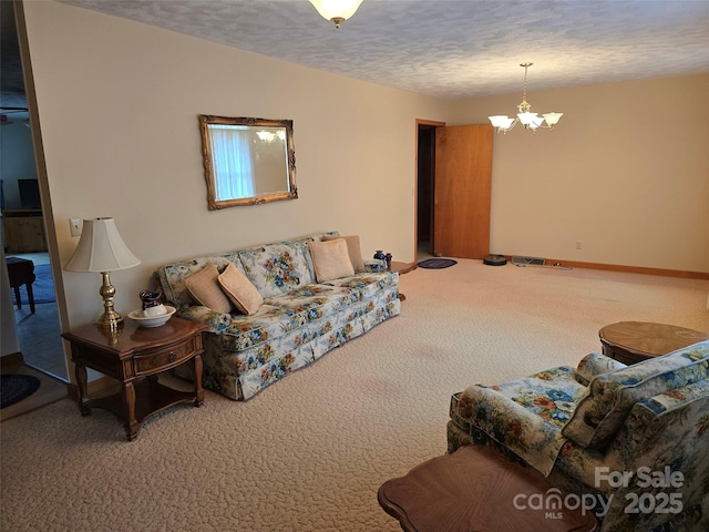 carpeted living room with a textured ceiling and an inviting chandelier