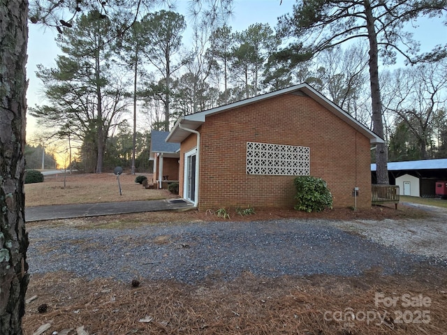 view of property exterior at dusk