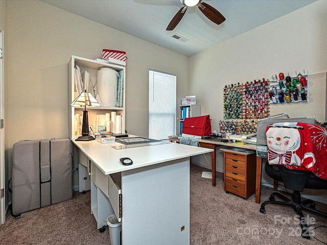 carpeted office with ceiling fan