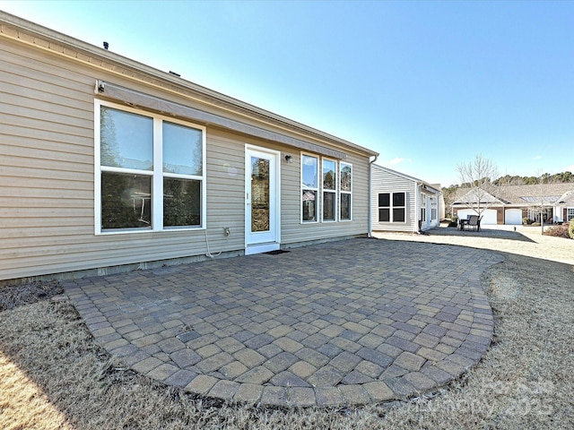 back of property featuring a patio area