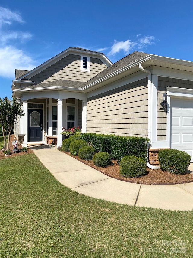 8024 Carolina Lakes Way, Fort Mill, SC 29707 - view of front of property with a front yard, covered porch, an attached garage, and a shingled roof