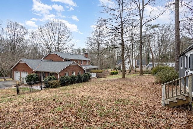 view of yard featuring a garage