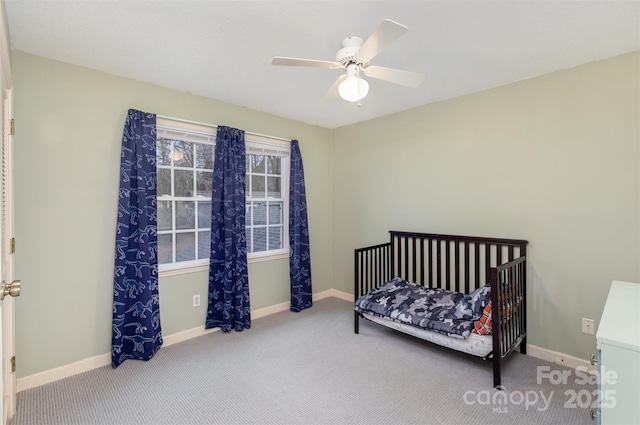 bedroom featuring carpet floors, baseboards, and a ceiling fan