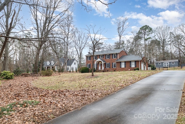 view of front of home featuring a residential view and brick siding