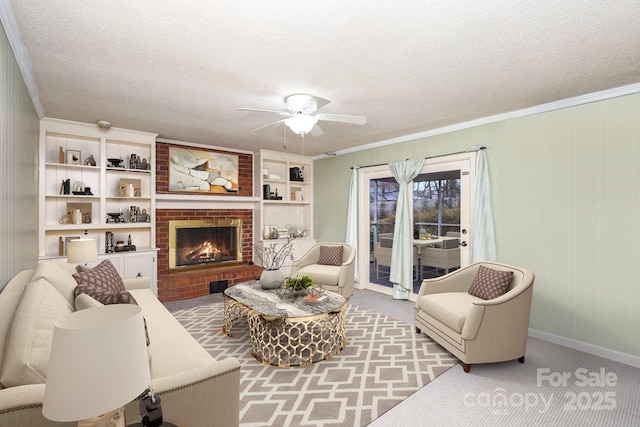 living room featuring a textured ceiling, a fireplace, light colored carpet, and crown molding