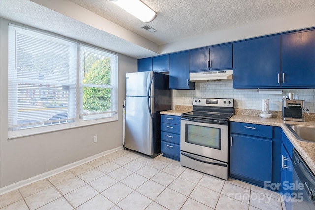 kitchen with stainless steel appliances, blue cabinets, light tile patterned floors, and backsplash