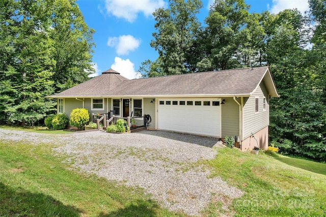 ranch-style house with a front lawn, a garage, and a porch