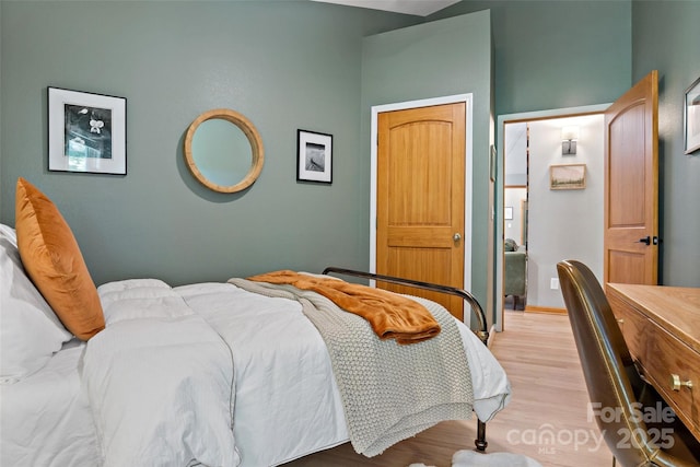 bedroom with light wood-type flooring