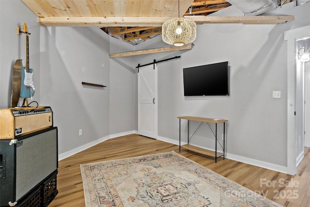 foyer featuring a barn door and hardwood / wood-style flooring