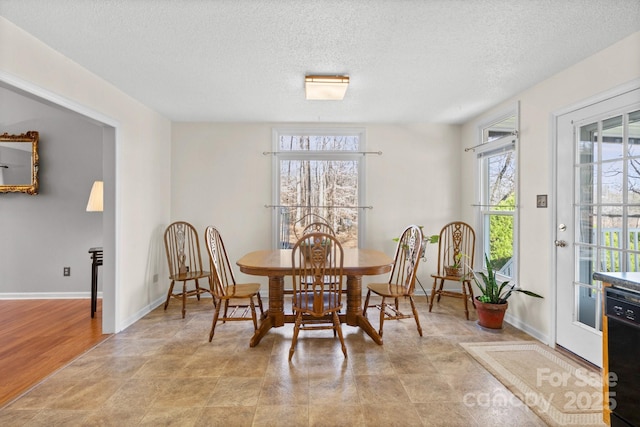 dining area with a textured ceiling