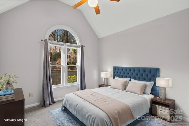 carpeted bedroom with ceiling fan and lofted ceiling