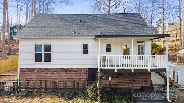 rear view of property with a porch