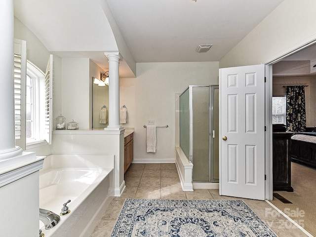 bathroom with decorative columns, vanity, and independent shower and bath