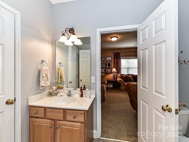 bathroom featuring vanity and toilet