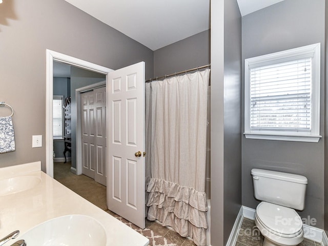 bathroom featuring vanity, a shower with curtain, and toilet