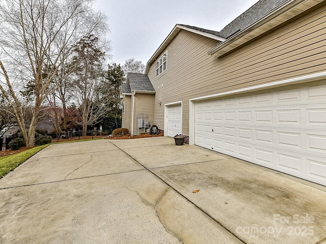 view of side of property featuring a garage