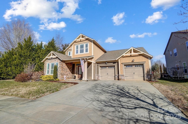 craftsman-style house with a garage and a front lawn