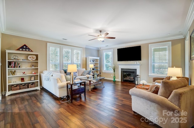 living room with ceiling fan, dark wood-type flooring, and ornamental molding