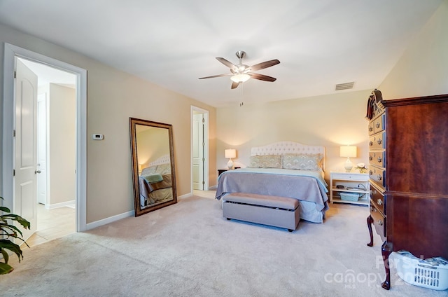 bedroom featuring ceiling fan and light carpet