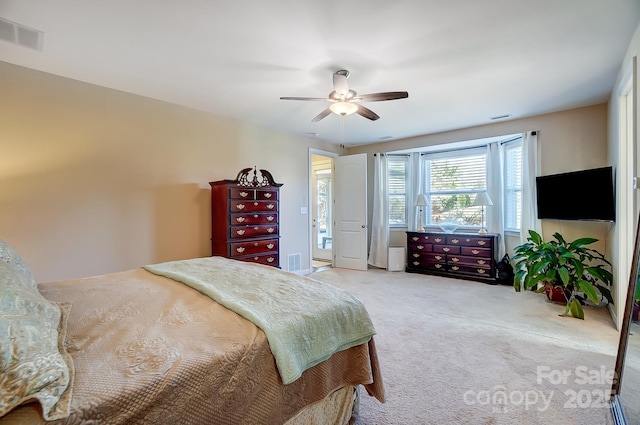 carpeted bedroom featuring ceiling fan