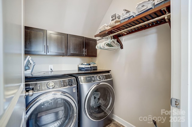 clothes washing area with independent washer and dryer, cabinets, and tile patterned flooring