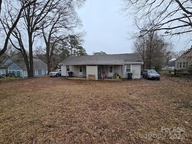 back of property featuring covered porch