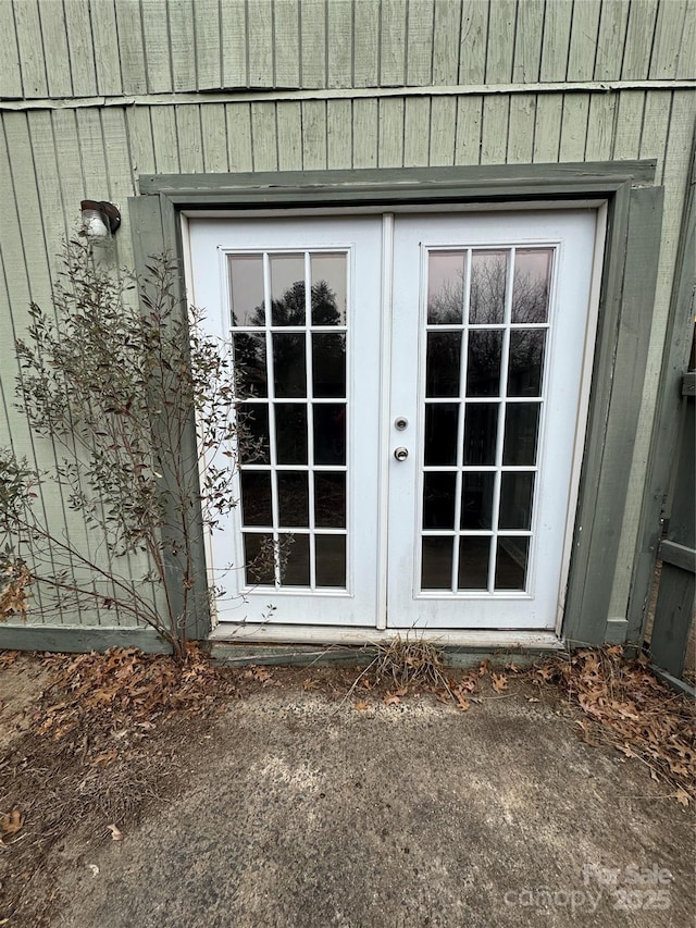 view of exterior entry featuring french doors