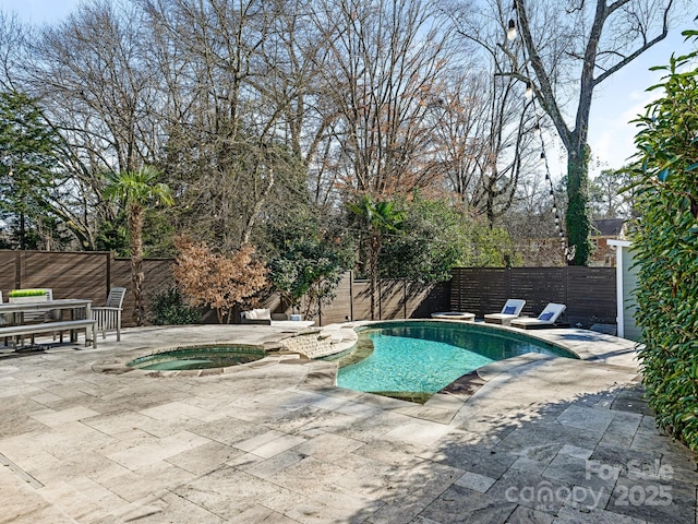 view of swimming pool with an in ground hot tub, a diving board, and a patio area