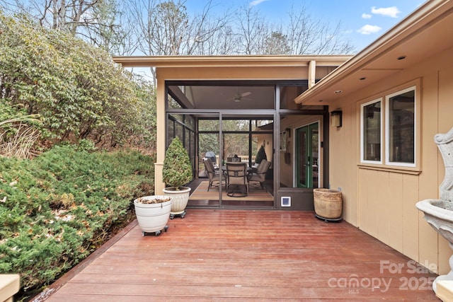 deck with a sunroom