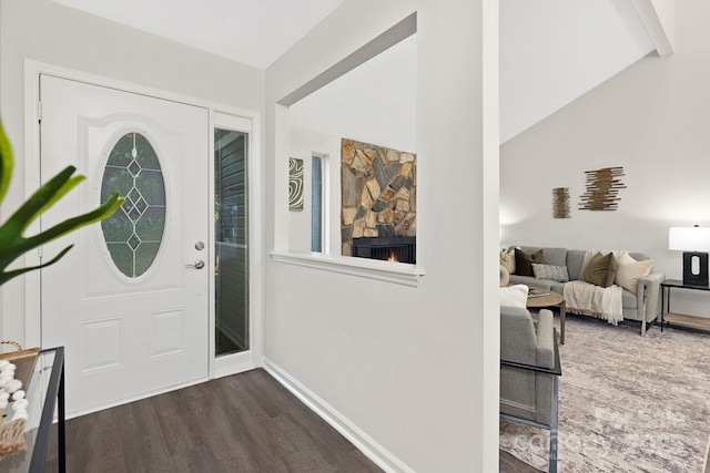 10912 Treebark Dr, Charlotte, NC 28226 - entrance foyer with dark wood-type flooring, baseboards, a fireplace, and lofted ceiling