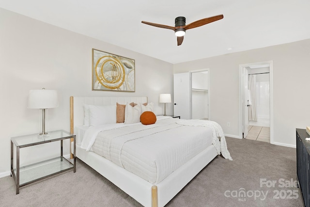 10912 Treebark Dr, Charlotte, NC 28226 - carpeted bedroom with baseboards, ensuite bath, and ceiling fan