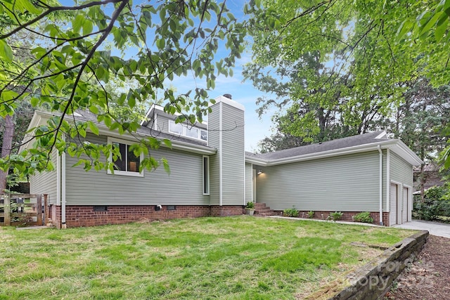 10912 Treebark Dr, Charlotte, NC 28226 - view of side of home featuring a lawn, a chimney, crawl space, and driveway