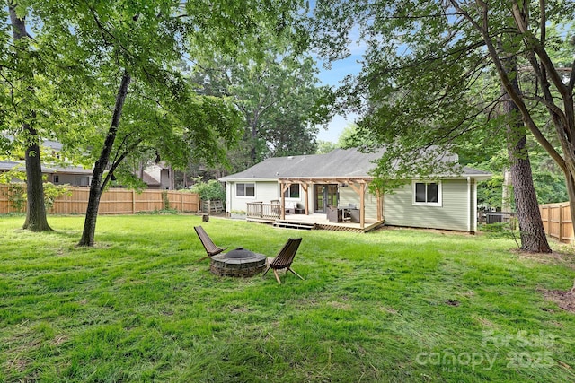 10912 Treebark Dr, Charlotte, NC 28226 - rear view of house featuring a fire pit and a wooden deck