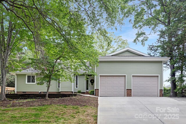 10912 Treebark Dr, Charlotte, NC 28226 - view of front of house featuring concrete driveway and a garage