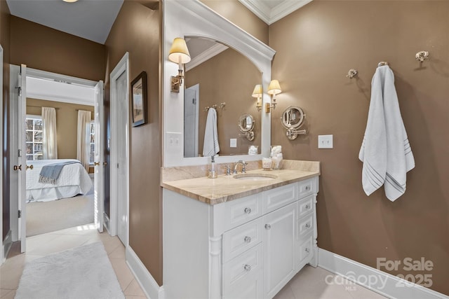 bathroom with vanity, ornamental molding, and tile patterned flooring