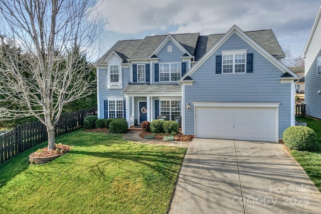 view of front of property with a garage and a front yard