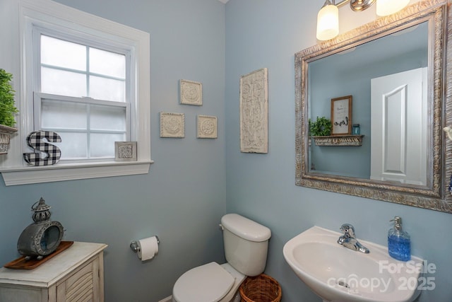 bathroom with sink and toilet