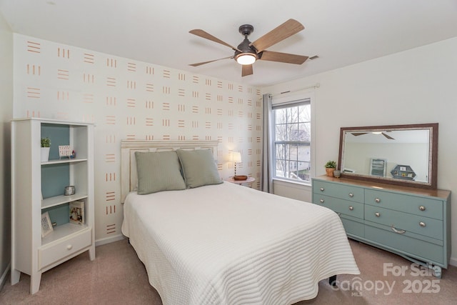 carpeted bedroom featuring ceiling fan