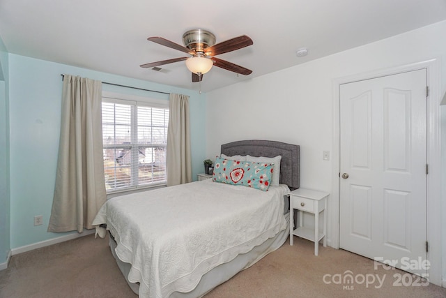 carpeted bedroom featuring ceiling fan