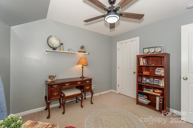 living area featuring lofted ceiling, light colored carpet, and ceiling fan