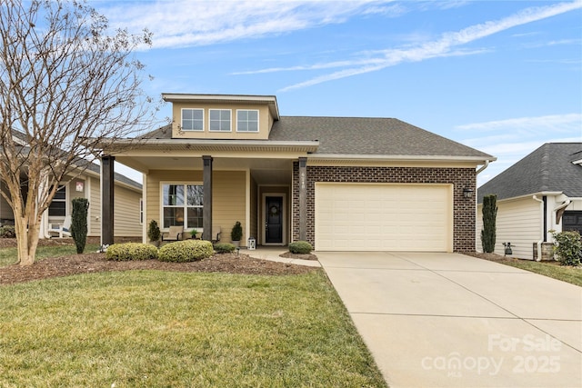 view of front facade featuring a garage, a front yard, and a porch