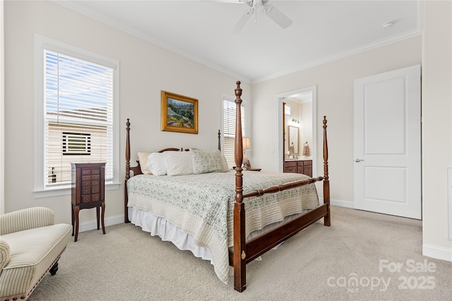 carpeted bedroom featuring crown molding, ceiling fan, and ensuite bathroom