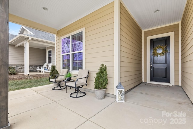 entrance to property featuring covered porch