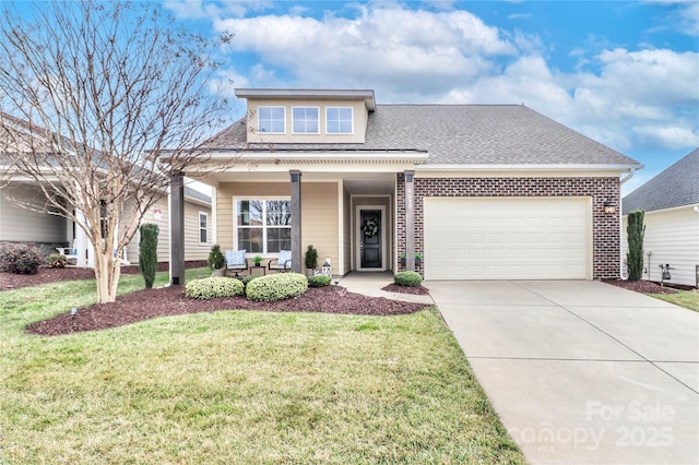 view of front of home featuring a porch, a garage, and a front lawn