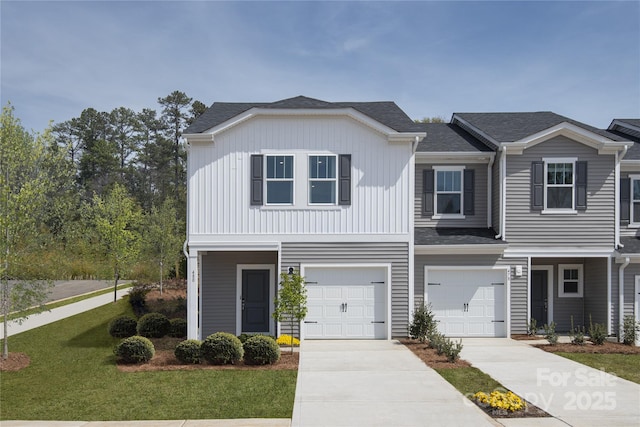 view of front of house with a garage and a front lawn