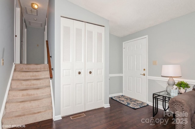 interior space featuring dark hardwood / wood-style flooring and vaulted ceiling